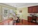 Charming dining area featuring hardwood floors, built-in desk, and natural light from the windows at 251 Sumac Trl, Woodstock, GA 30188