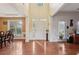Open foyer boasts hardwood floors, high ceilings, white trim, and abundant natural light from the large windows at 251 Sumac Trl, Woodstock, GA 30188