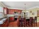Well-equipped kitchen with stainless steel appliances, granite countertops, and hardwood floors at 251 Sumac Trl, Woodstock, GA 30188