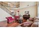 Inviting living room features hardwood floors, a fireplace, and a staircase leading to the second floor at 251 Sumac Trl, Woodstock, GA 30188