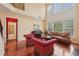 Bright and airy living room with hardwood floors, a fireplace, and large windows providing natural light at 251 Sumac Trl, Woodstock, GA 30188