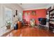 A living room filled with natural light, hardwood floors, a desk, and a door to the outside at 251 Sumac Trl, Woodstock, GA 30188