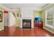 Bright living room boasts a fireplace, built-in shelving, and large windows with natural light at 251 Sumac Trl, Woodstock, GA 30188