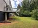 Enjoy the outdoors in this backyard featuring a covered patio and mature trees at 2691 Old South Dr, Jonesboro, GA 30236