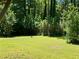 Lush backyard featuring a level lawn, mature trees and lots of privacy at 2691 Old South Dr, Jonesboro, GA 30236