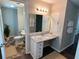 Bathroom featuring a marble countertop vanity with a large mirror and modern lighting at 2691 Old South Dr, Jonesboro, GA 30236