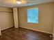 Bedroom featuring wood-look flooring, closet, and natural light from the window at 2691 Old South Dr, Jonesboro, GA 30236