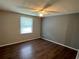 Bedroom with neutral walls, hardwood floors, and natural light from the window at 2691 Old South Dr, Jonesboro, GA 30236