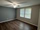 This is a primary bedroom with wood floors and a window with natural light at 2691 Old South Dr, Jonesboro, GA 30236