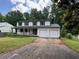 Charming two-story home with a covered porch, a two-car garage, and classic curb appeal at 2691 Old South Dr, Jonesboro, GA 30236