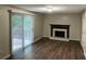 Cozy living room features wood-burning fireplace and sliding glass door to deck at 2691 Old South Dr, Jonesboro, GA 30236