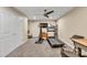 Finished basement area with a ceiling fan, exercise equipment, and storage, offering a functional space at 3150 Seven Oaks Dr, Cumming, GA 30041