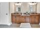 Bathroom featuring double sinks, mirrors, and wood vanities at 3150 Seven Oaks Dr, Cumming, GA 30041