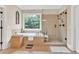 Bathroom featuring a soaking tub with a window view and a glass shower at 3150 Seven Oaks Dr, Cumming, GA 30041