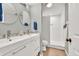 Bathroom showcasing double vanity with chrome fixtures, an enclosed walk in shower, and tile flooring at 3150 Seven Oaks Dr, Cumming, GA 30041