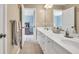Bathroom with a double sink vanity, neutral walls, and access to an adjacent bedroom at 3150 Seven Oaks Dr, Cumming, GA 30041