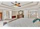 Bedroom showcasing beautiful ceilings, closet, and bed with blue throw pillows at 3150 Seven Oaks Dr, Cumming, GA 30041