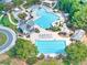 Community pool complex with swimming pools, slides, lounge areas, clubhouse, and landscaped surroundings at 3150 Seven Oaks Dr, Cumming, GA 30041