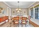 Elegant dining room featuring hardwood floors, chandelier, and traditional furnishings at 3150 Seven Oaks Dr, Cumming, GA 30041