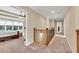 Bright upstairs hallway with carpet and decorative railing leads to bedrooms, offering space and style at 3150 Seven Oaks Dr, Cumming, GA 30041