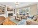 Comfortable living room featuring a fireplace, built-in shelving, and lots of natural light at 3150 Seven Oaks Dr, Cumming, GA 30041