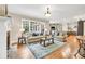 Bright and open living room featuring a stone fireplace and hardwood floors at 3150 Seven Oaks Dr, Cumming, GA 30041