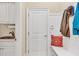 Mudroom includes a sink, cabinets, bench, and hooks for coats and storage at 3150 Seven Oaks Dr, Cumming, GA 30041