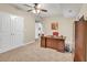 Home office features a built-in desk, double closets, and carpet, providing a functional workspace at 3150 Seven Oaks Dr, Cumming, GA 30041