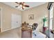 Inviting office space featuring a ceiling fan, natural lighting and a wooden desk at 3150 Seven Oaks Dr, Cumming, GA 30041
