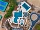 Aerial view of the community pool area, featuring multiple pools, a slide, and clubhouse at 3150 Seven Oaks Dr, Cumming, GA 30041