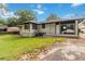 Brick home with a large backyard, patio, and detached garage at 6873 Church St, Riverdale, GA 30274