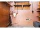 Unfinished basement offering storage with open shelves and utility equipment at 6873 Church St, Riverdale, GA 30274