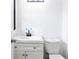 Modern bathroom featuring a new vanity, updated fixtures, and toilet at 6873 Church St, Riverdale, GA 30274