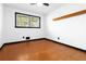 Bedroom featuring hard wood floors, neutral walls, and ceiling fan at 6873 Church St, Riverdale, GA 30274