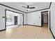 Open living room space with lots of light, ceiling fan, and neutral paint at 6873 Church St, Riverdale, GA 30274
