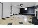 Open living area featuring stylish floors, ceiling fan, and accent wall at 6873 Church St, Riverdale, GA 30274