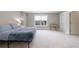 Spacious bedroom featuring neutral walls, carpet and natural light from the window at 130 Lapis Lake Pt, Fayetteville, GA 30215
