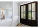 Bright entryway view of bathroom and the home's exterior at 130 Lapis Lake Pt, Fayetteville, GA 30215