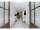 Open foyer with hardwood floors and view to the living room at 130 Lapis Lake Pt, Fayetteville, GA 30215