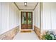 Elegant double front doors with 'hey y'all' doormat at 130 Lapis Lake Pt, Fayetteville, GA 30215