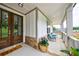 Cozy covered porch with rocking chairs and decorative accents at 130 Lapis Lake Pt, Fayetteville, GA 30215