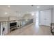View of the home's open landing, showcasing the hardwood floors and railing overlooking the fireplace at 130 Lapis Lake Pt, Fayetteville, GA 30215