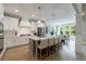 Spacious kitchen with a large island, stainless steel appliances, and an open floor plan to the dining area at 130 Lapis Lake Pt, Fayetteville, GA 30215