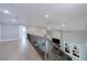 Second-floor view of the living room with fireplace, staircase, and open layout at 130 Lapis Lake Pt, Fayetteville, GA 30215