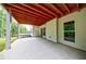 Covered patio area, great for outdoor seating and entertainment, with lush greenery in view at 130 Lapis Lake Pt, Fayetteville, GA 30215