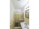 Full bathroom featuring a standing shower with glass doors and a single sink vanity at 213 Linda Dr, Tucker, GA 30084