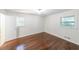 Bedroom featuring hardwood floors, an open doorway, and a window at 213 Linda Dr, Tucker, GA 30084