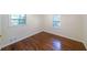 Bedroom featuring hardwood floors, two windows and neutral wall color at 213 Linda Dr, Tucker, GA 30084