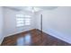 Bedroom featuring hardwood floors, blinds, and a closet at 213 Linda Dr, Tucker, GA 30084