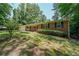 Traditional brick home with green lawn and mature trees at 213 Linda Dr, Tucker, GA 30084